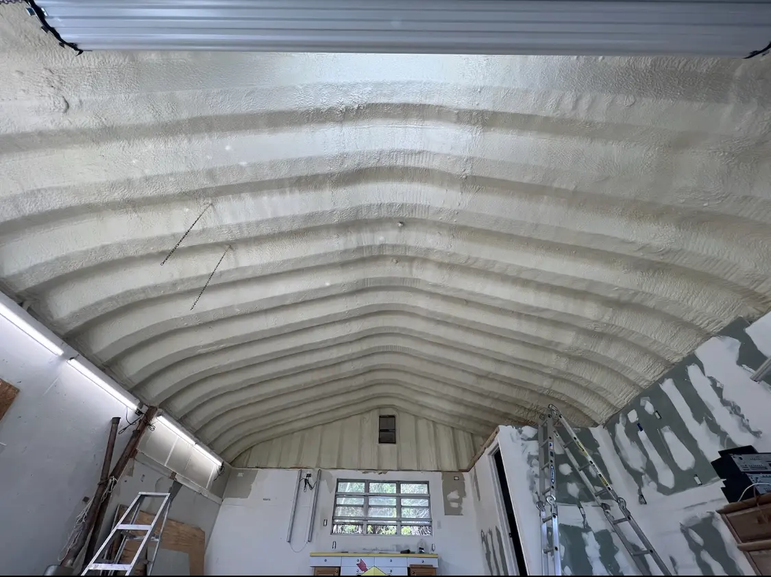 Spray polyurethane foam applied to the underside of a metal roof deck in Beckley